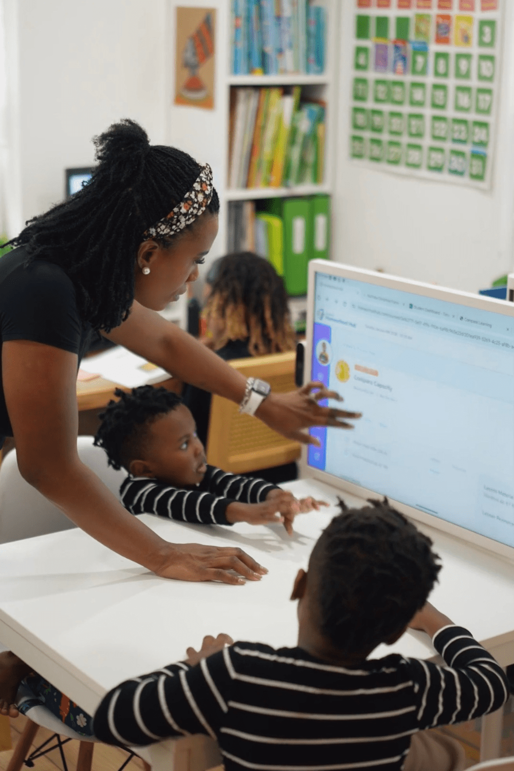 Gervase Ware teaching her children in a homeschool setting