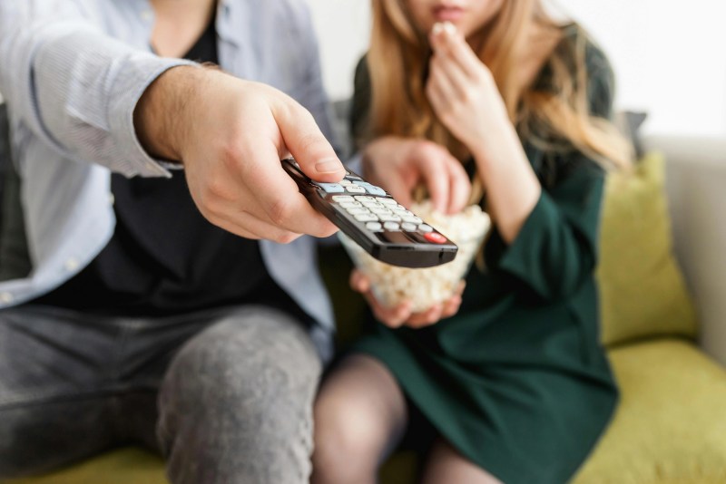 Close-up of someone changing the channel