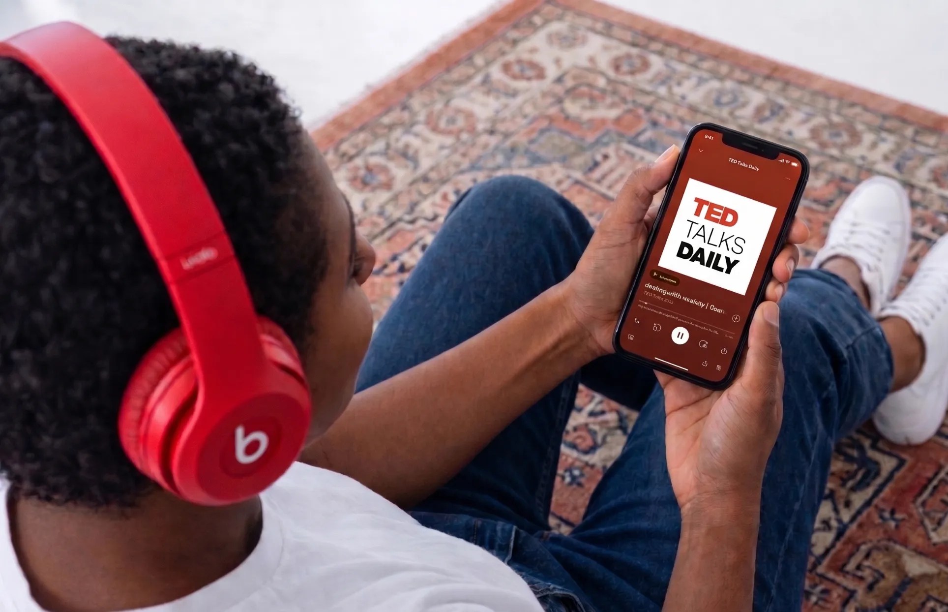 Someone listening to TED Talk on Spotify