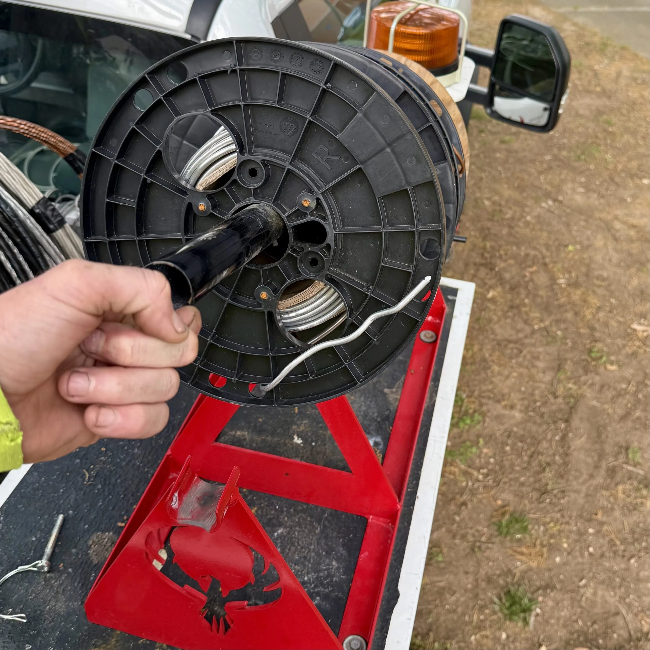 Securely dispense copper from your bucket truck. The lineman's time saver.