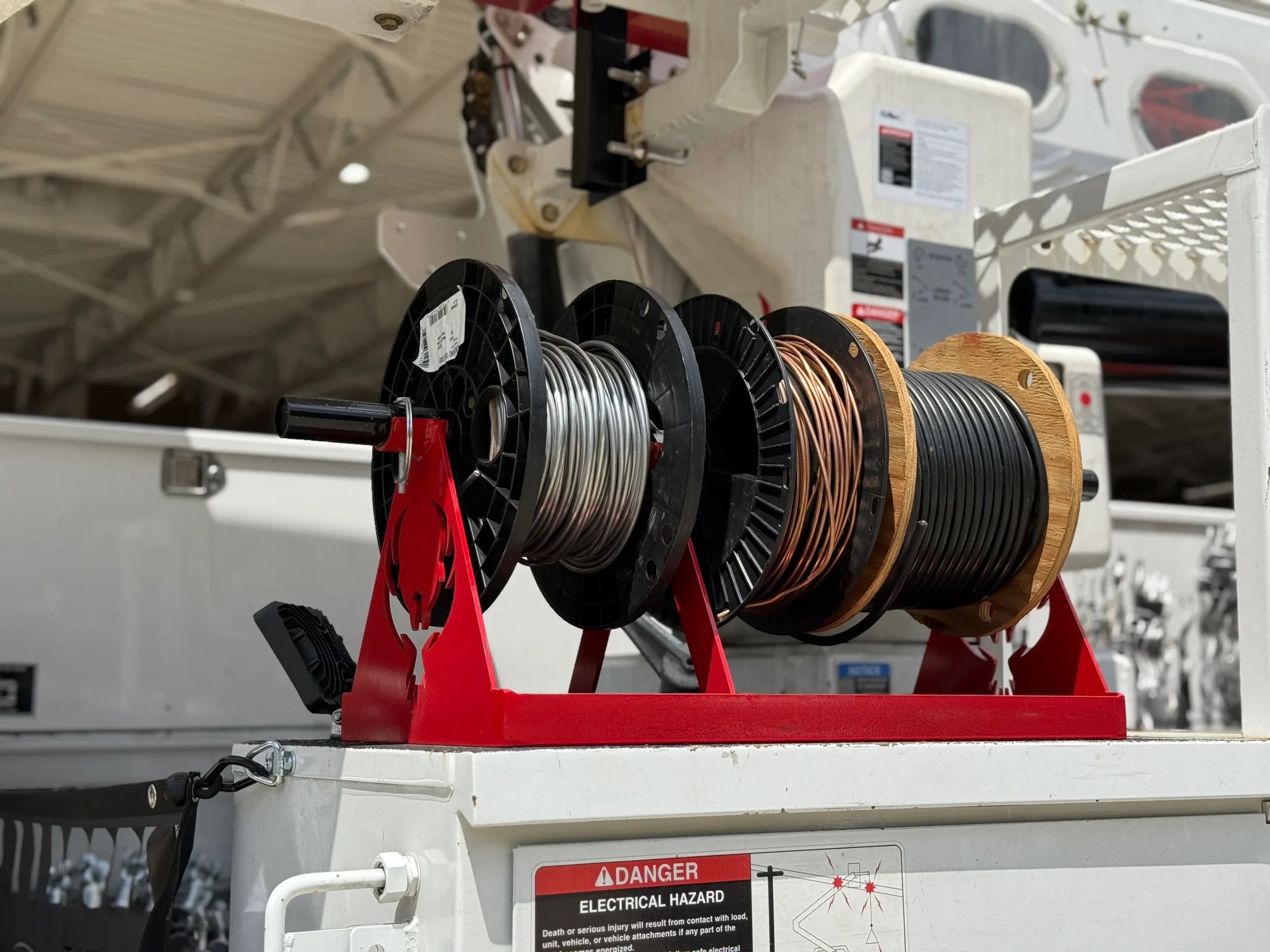Keep your reels ready to pull with the Hardline Wire Rack — a reliable bucket truck storage product.