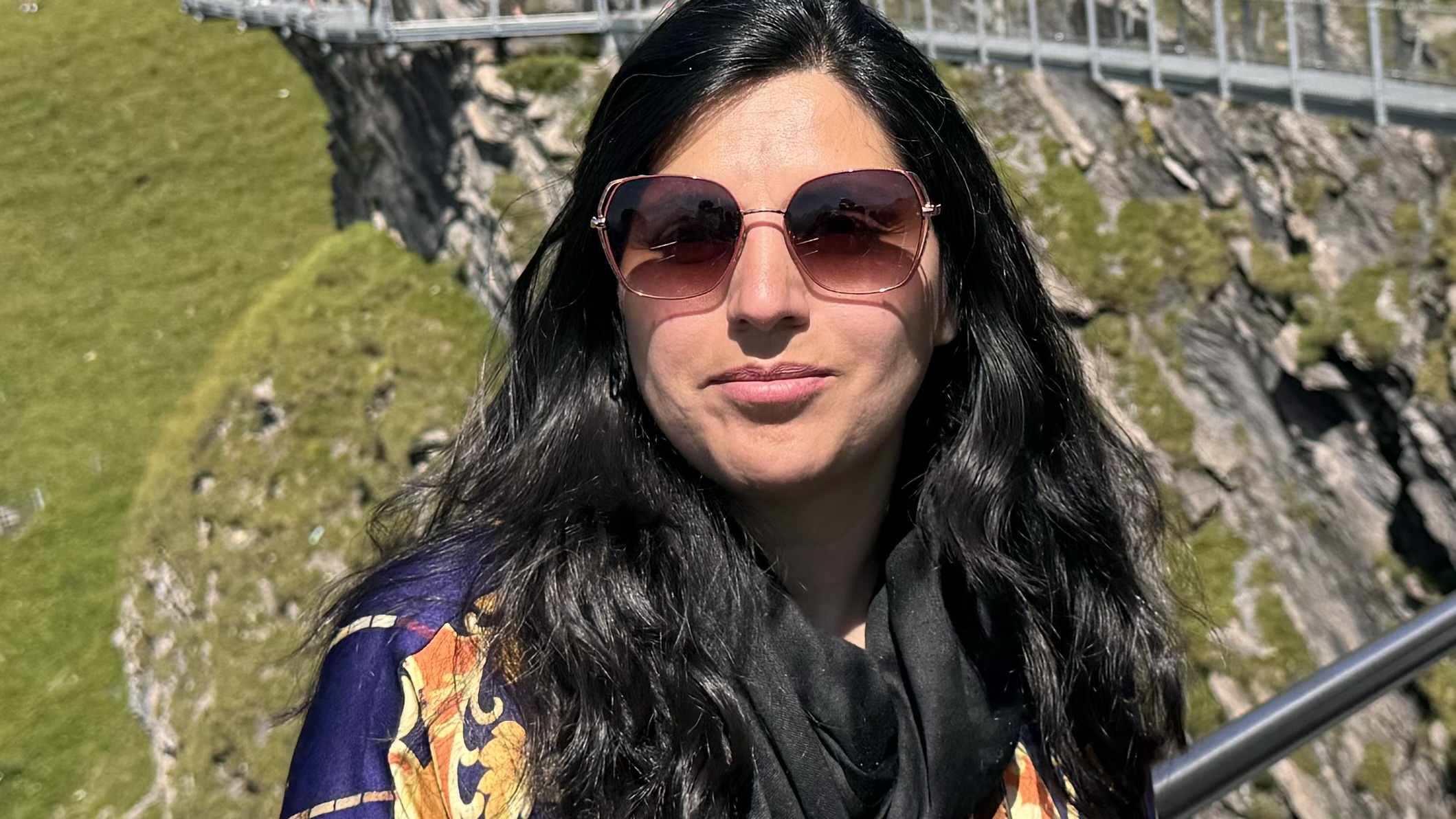 lady wearing sunglasses smiling