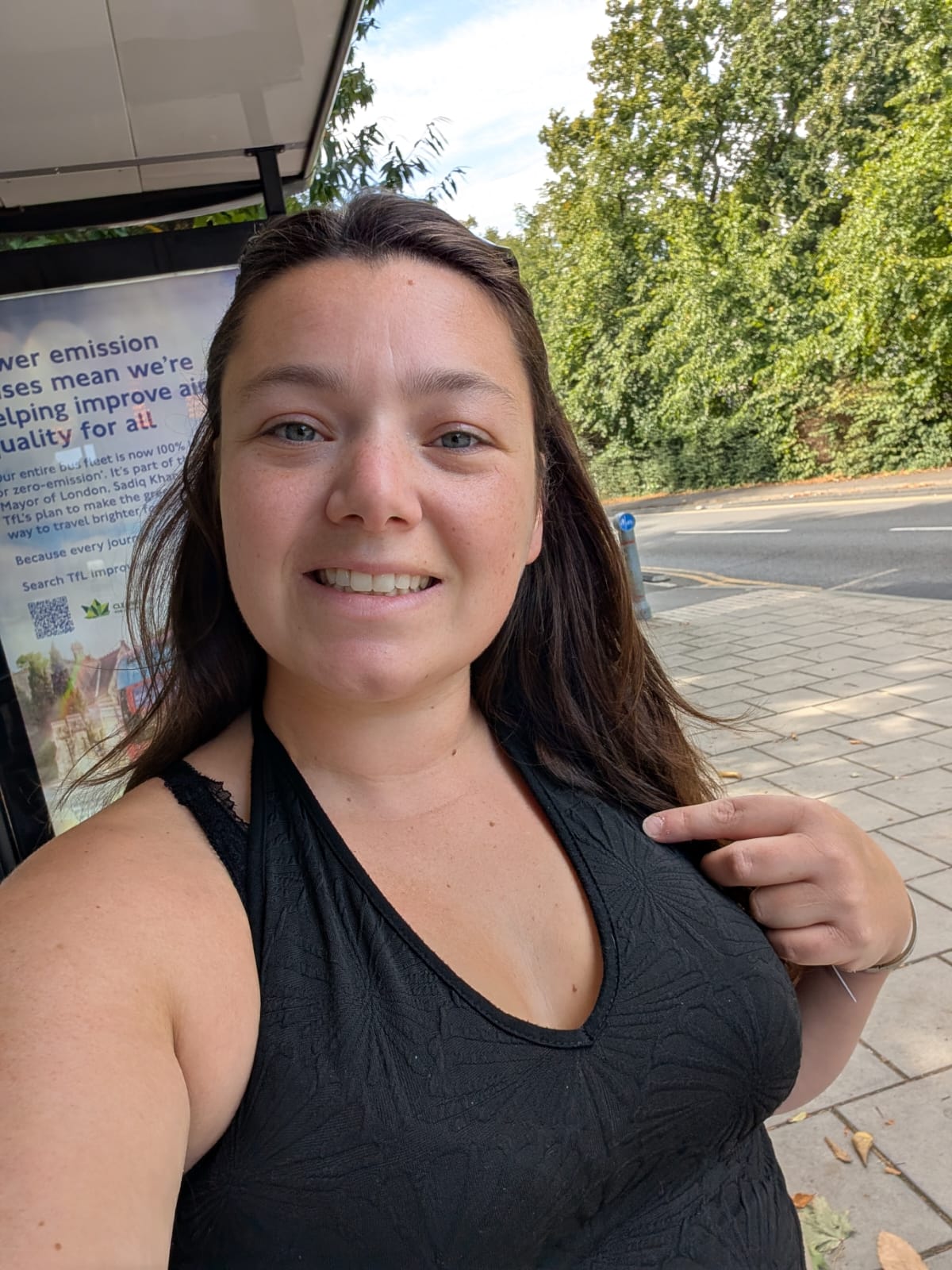 lady with brown hair wearing black top