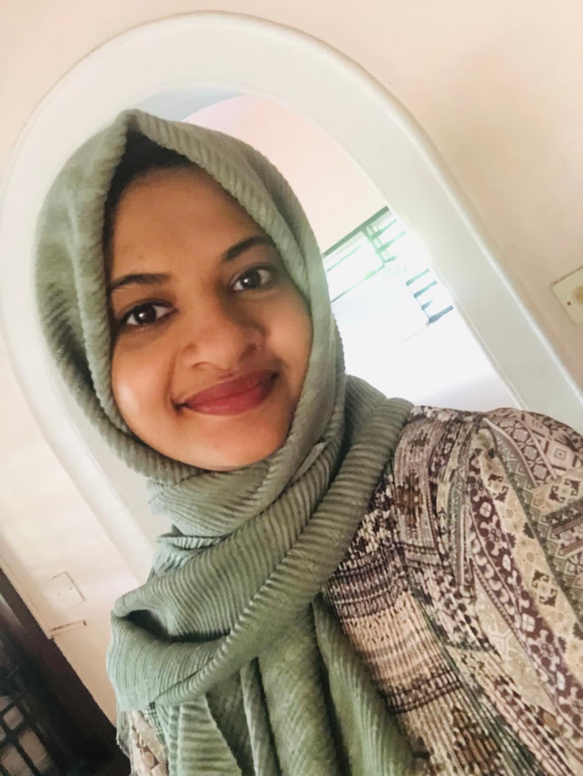 Lady in headscarf smiling