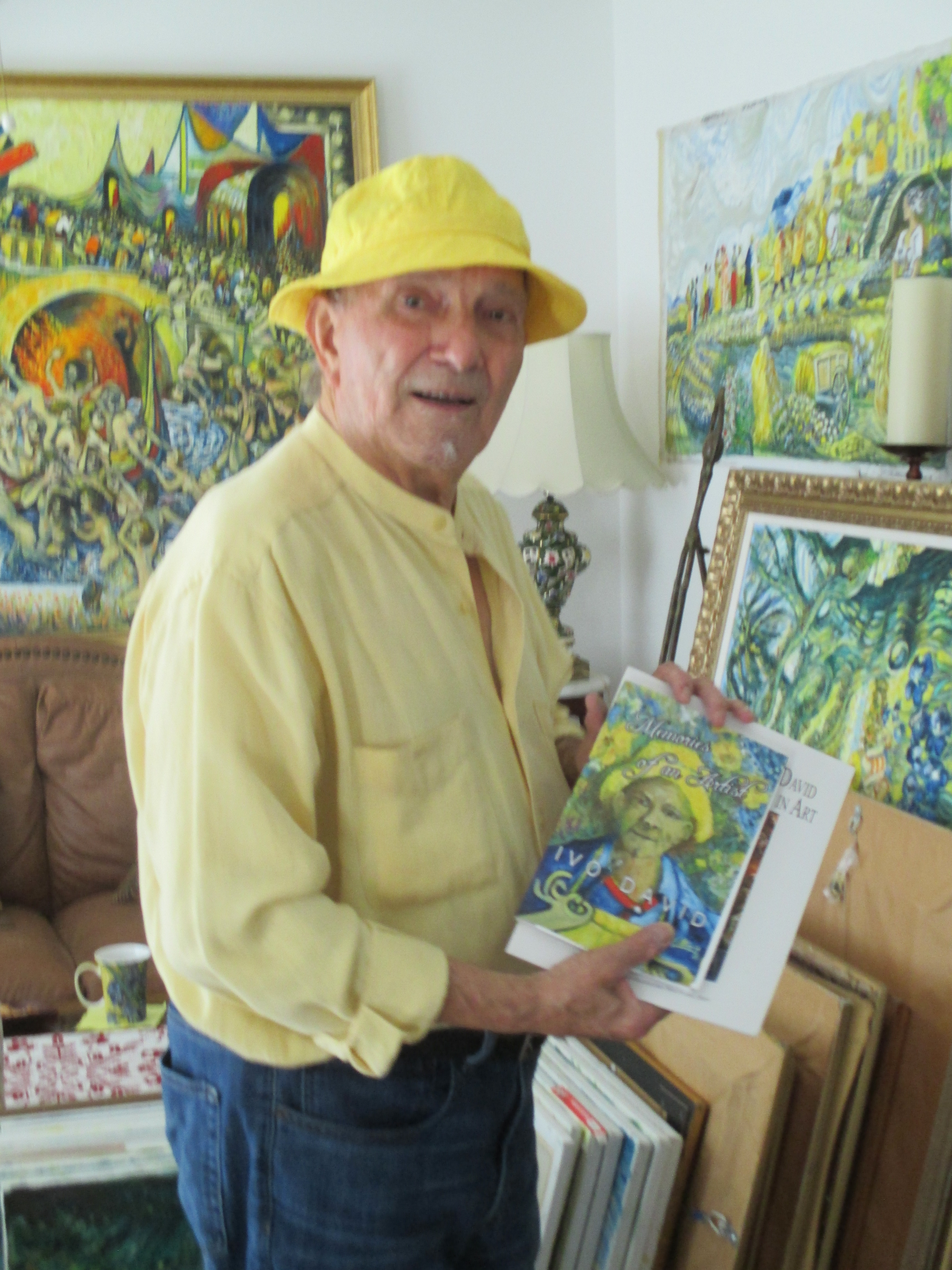 Fine Artist Ivo David with his book of poems Memories of an Artist.