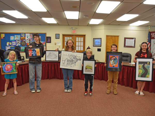 GASD examines budget; hires assistant superintendent 2 Gettysburg Area School District (GASD) students presented their art at the school board meeting Monday, May 19. Pictured from left are James Gettys Elementary first grader Emma Carter with her tempera painting, Gettysburg Area High School (GAHS) senior Madison Bensinger with her digital illustration, Gettysburg Area Middle School eighth grader Ruby Lancaster with her pen and ink piece, Franklin Township Elementary second grader Ellis Rice for his chalk pastels piece, Lincoln Elementary fifth grader Casey Cooke with a mixed media piece, and Franklin Township Elementary fifth grader Lillian Davis with a chalk pastels piece. Lancaster and Bensinger are also holding GAHS senior Sheng Hu's pencil drawing. (Photo Courtesy of GASD)