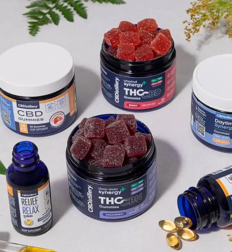 Variety of CBD and THC edible products in jars and bottles.