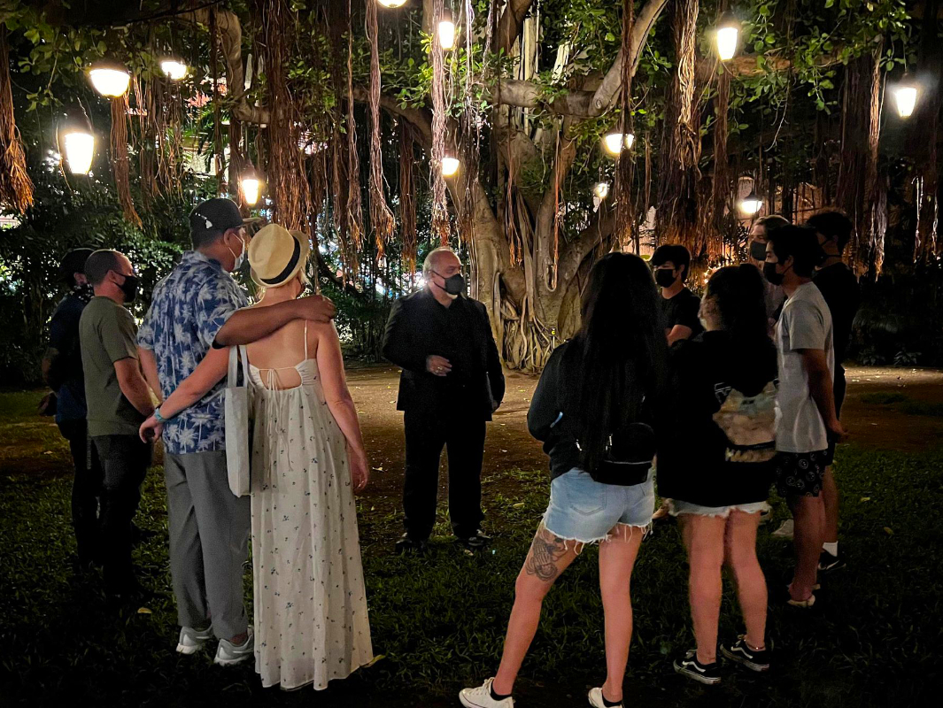 Mysteries of Hawaii\'s Haunted Historical Waikiki Tour at the Banyan tree in front of Royal Hawaiian Hotel