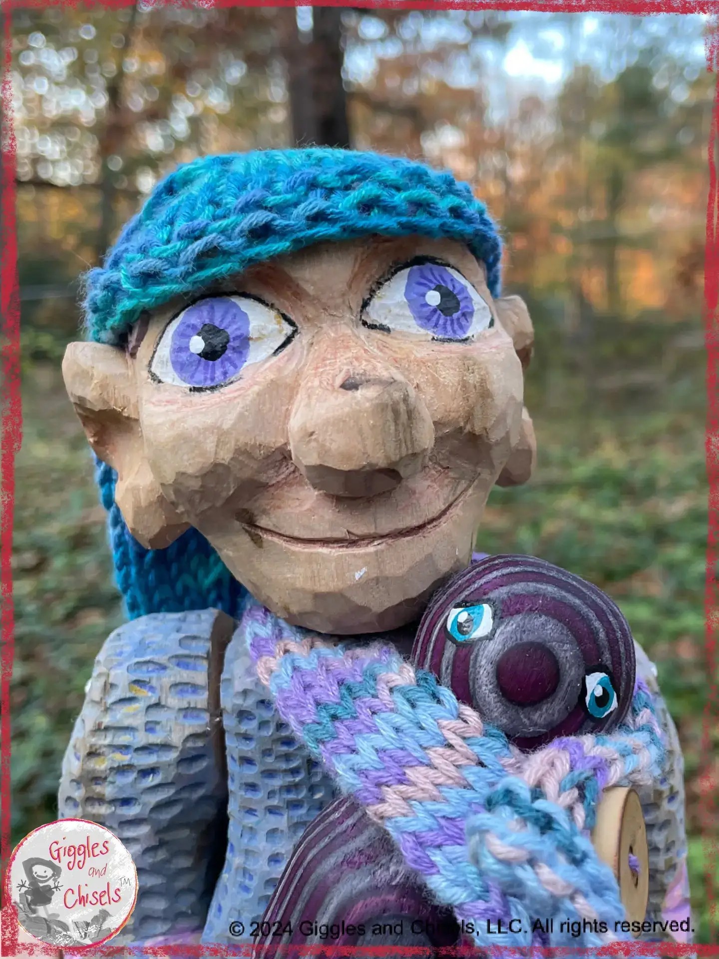 Petite Clothilde, a wooden puppet in blue and purple shades