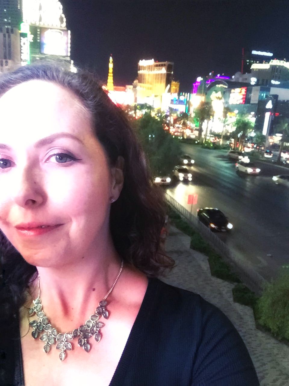 A selfie of me with the Las Vegas lights in the background