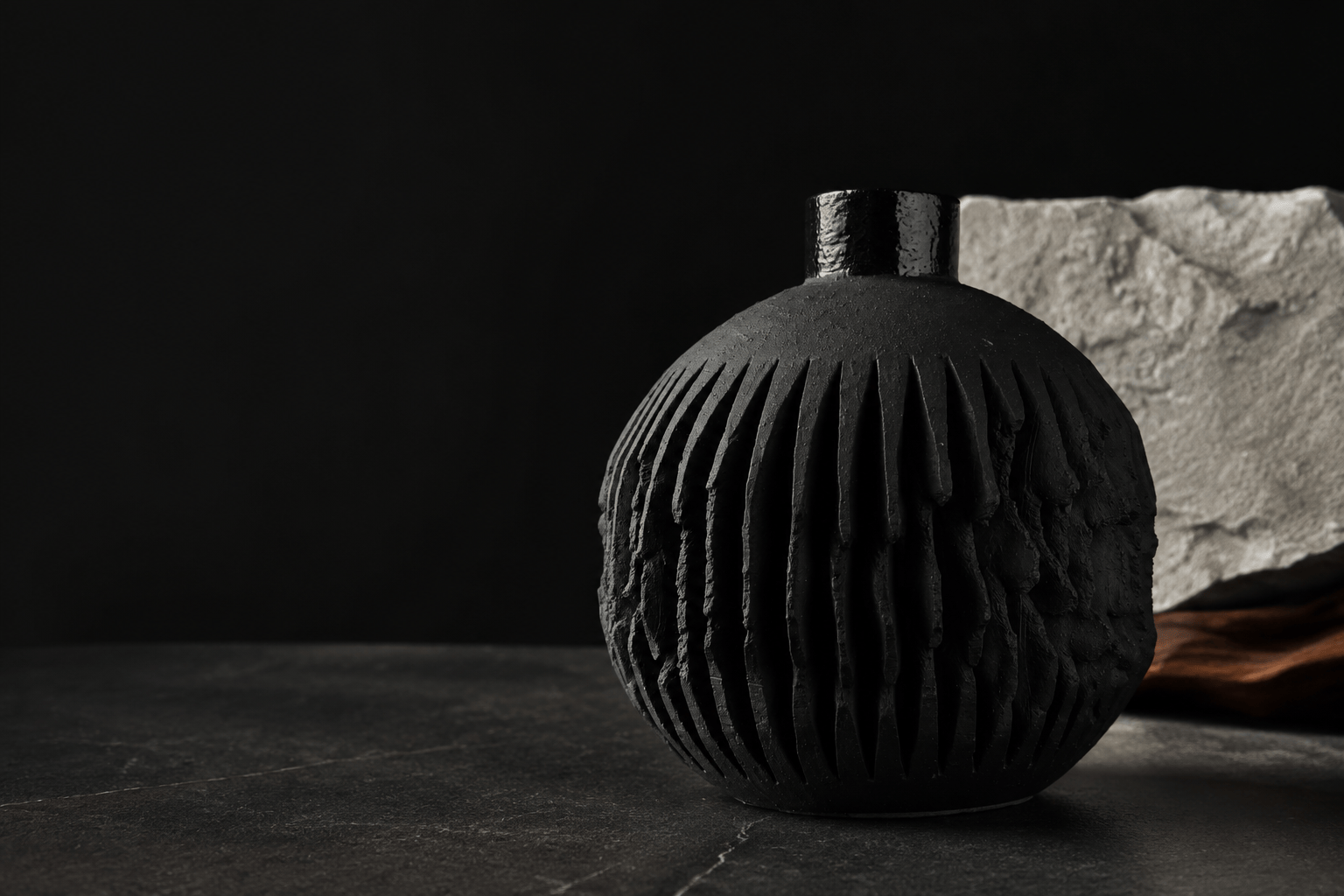 JUNIQUE handmade black ceramic gin bottle