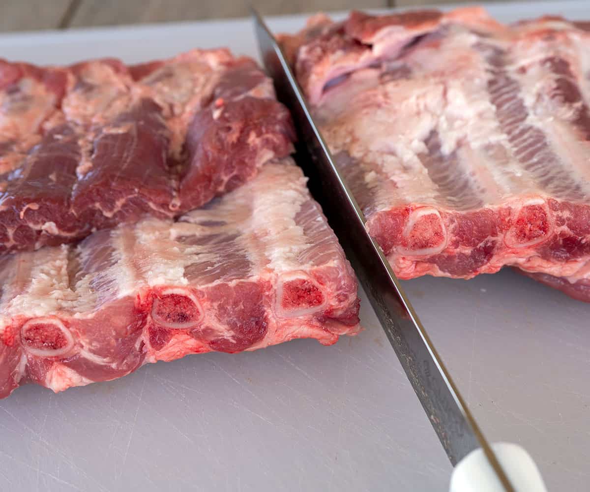 Cutting ribs into individual pieces.