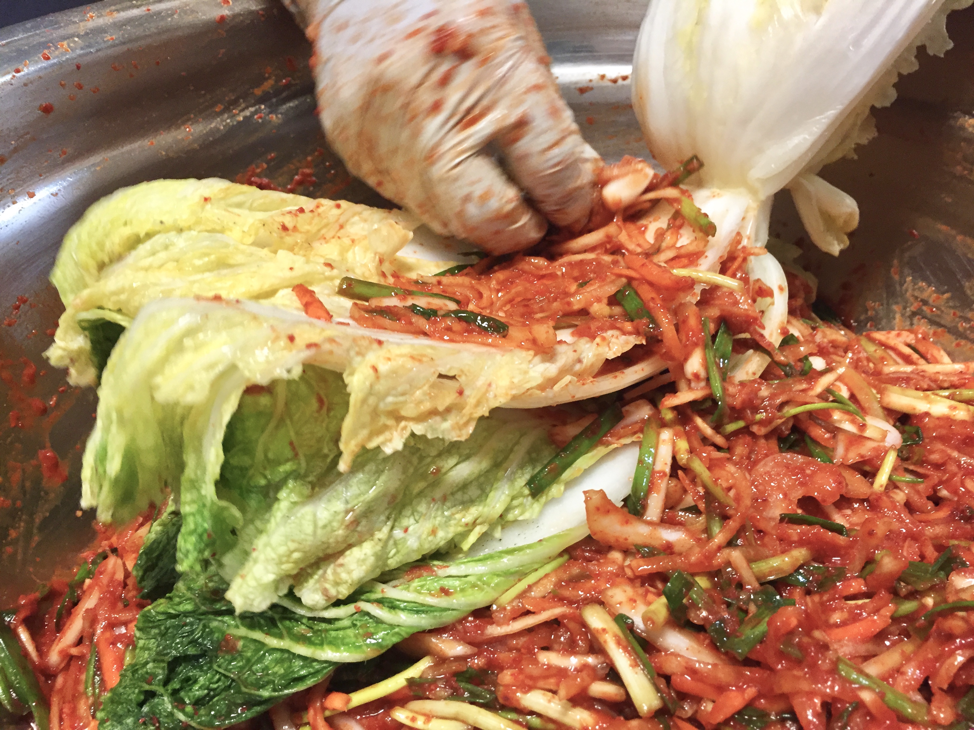 9. Add sauce-stuffing mixture between cabbage leaves.