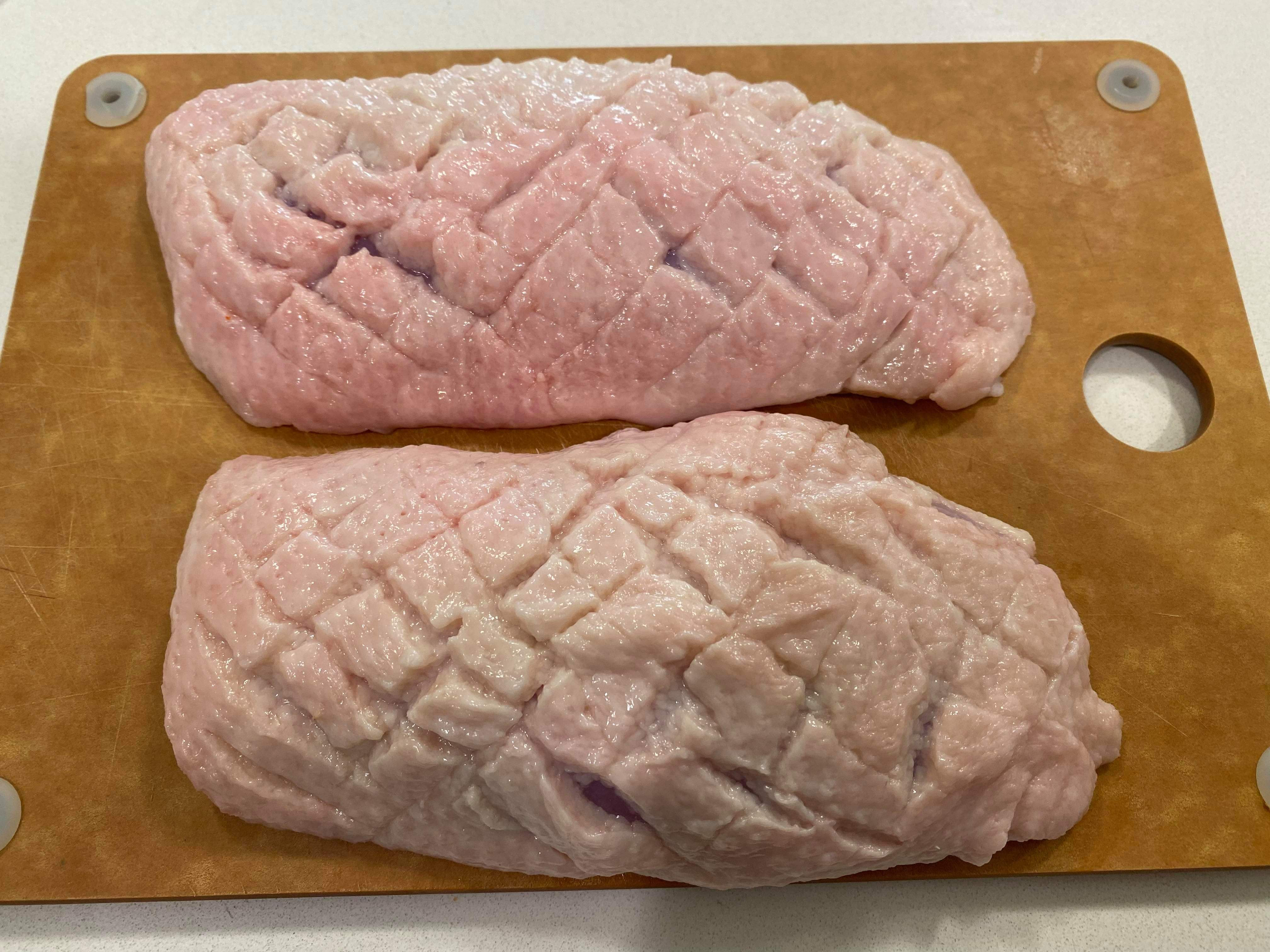 Duck breasts, skin scored.