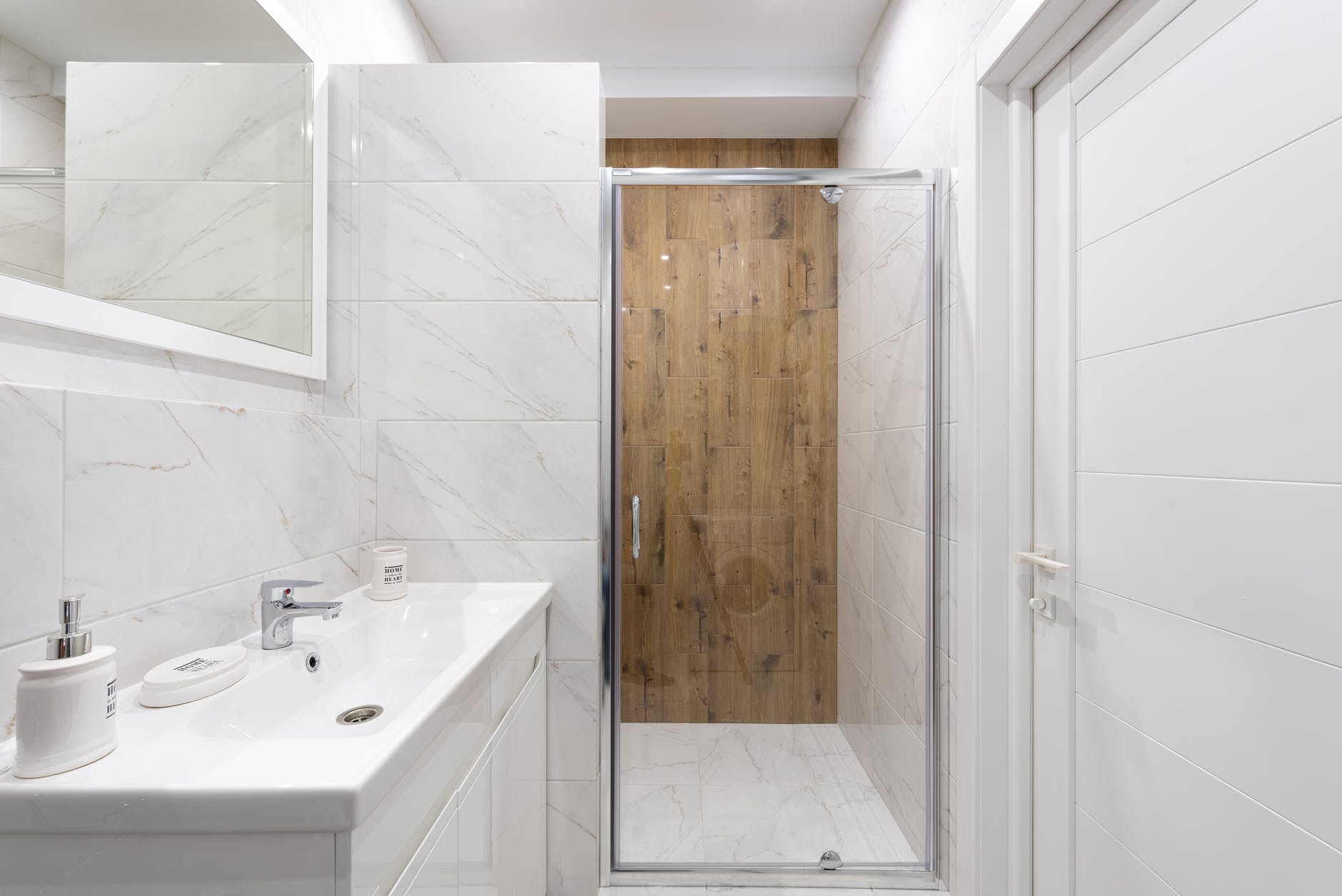 contemporary bathroom interior with washbasin and glass door