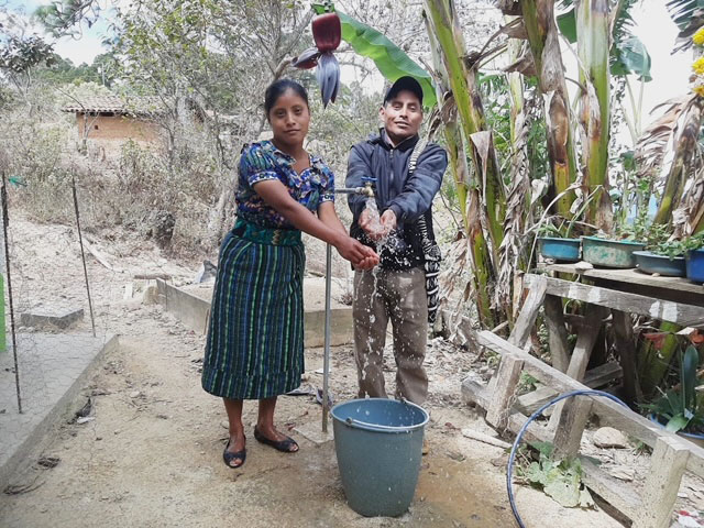 The community of Xejox celebrates the arrival of clean water.