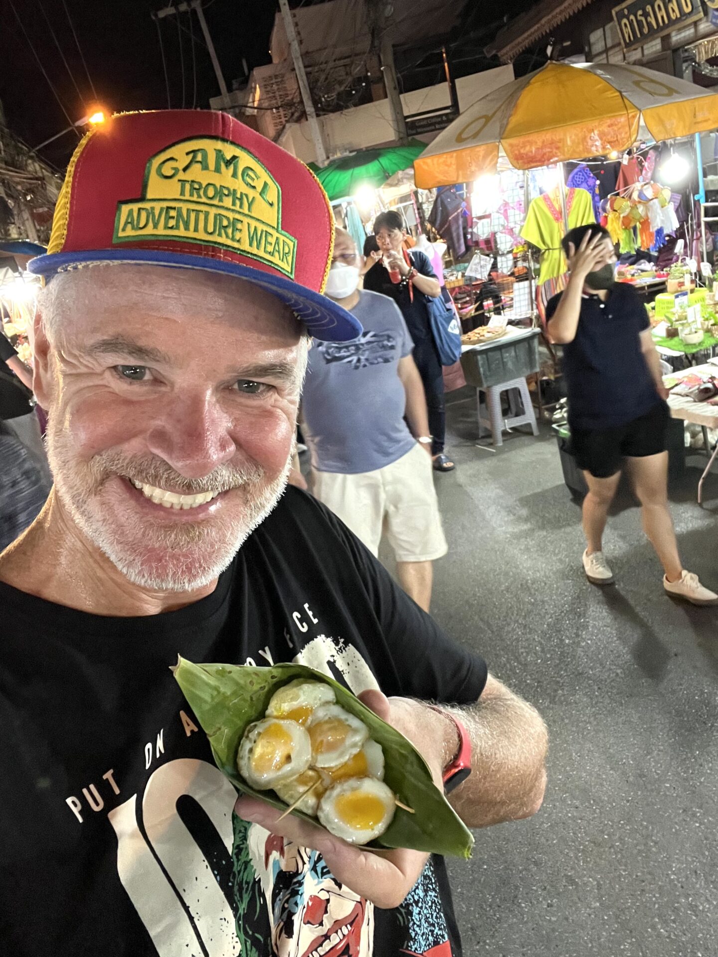 Trying quail eggs in Chiang Mai before beginning my slow boat journey to Laos