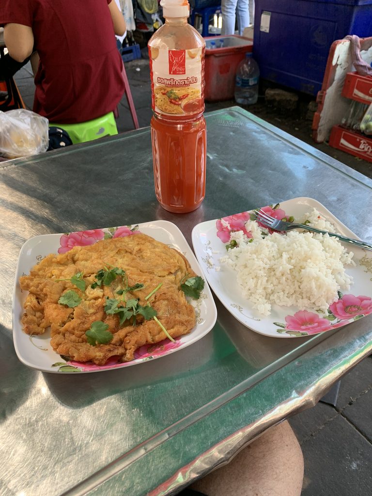 A Thai omelette and rice I ordered on the street on my first day in Bangkok. Making Anthony Bourdain proud