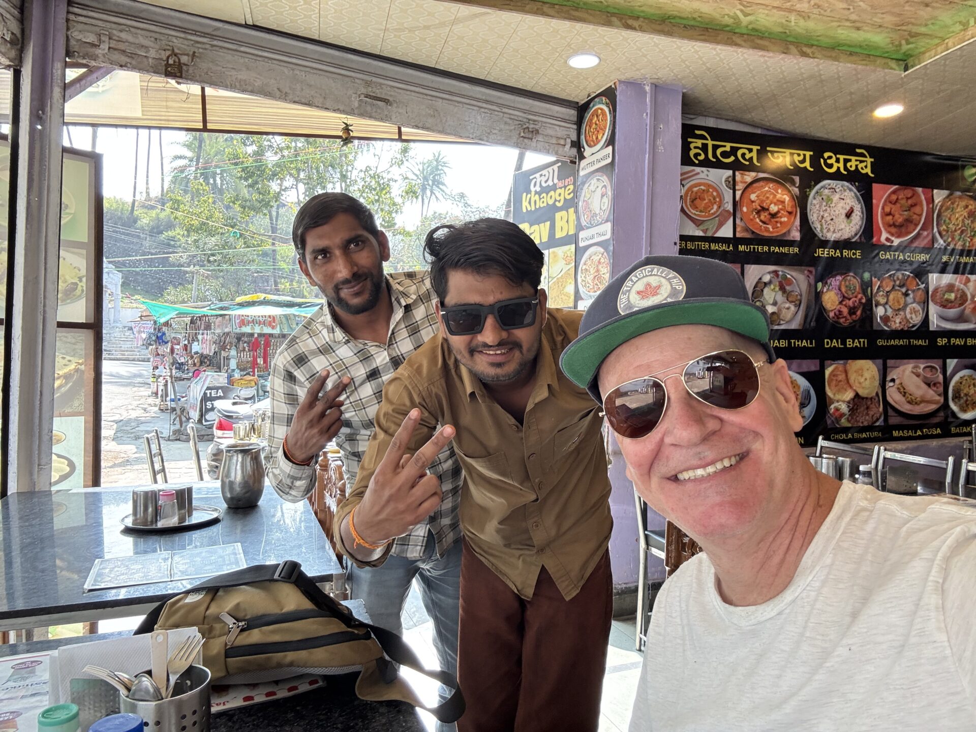 Taking a selfie with patrons from a restaurant in the Dilwara neighbourhood