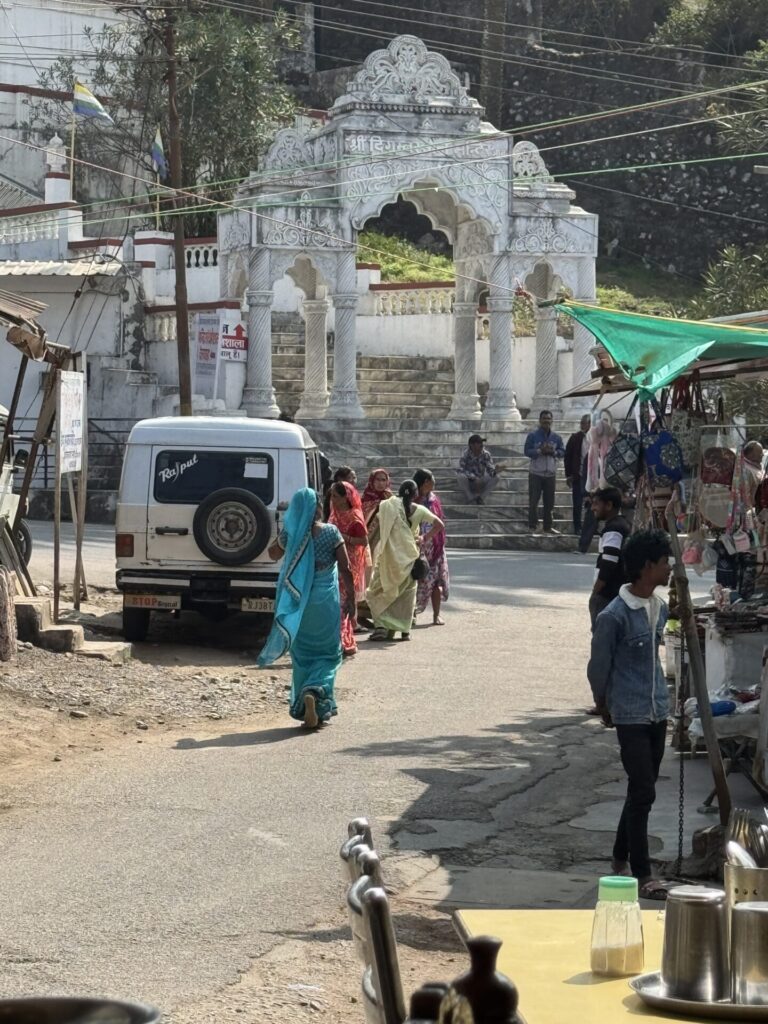 Jain worshipers walking outside the restaurant I was eating at