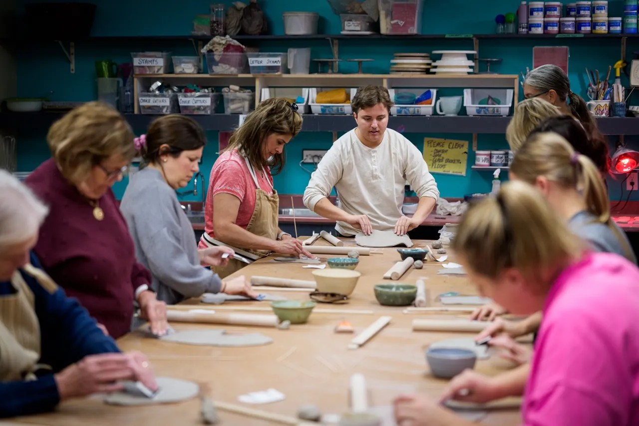 a photo of a hand building pottery class at GNAG