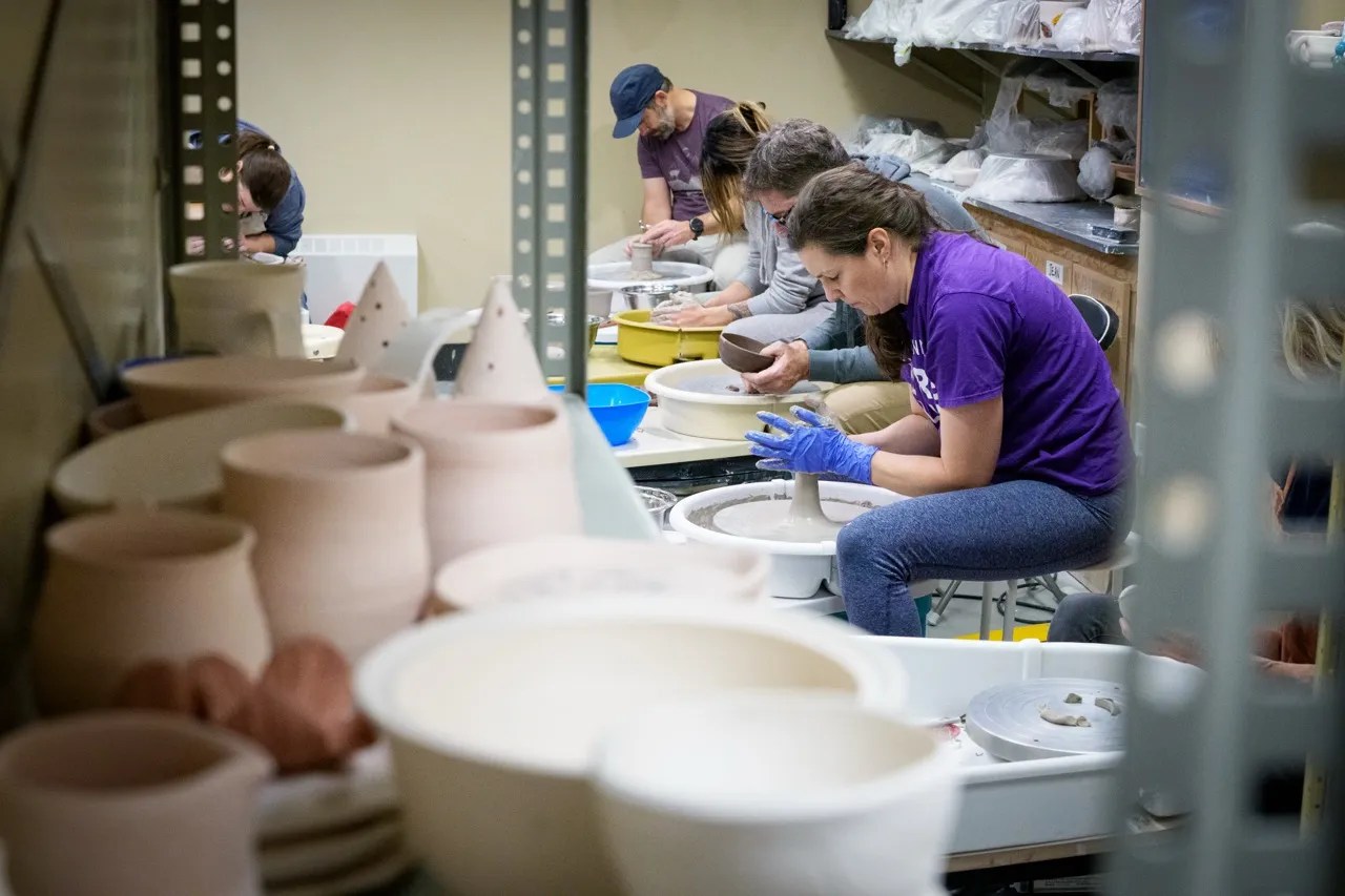a photo of a pottery wheel class at GNAG.