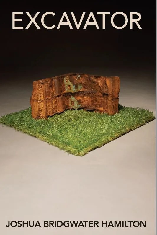 a house in cast metal on a square of fake grass on a black gradient background