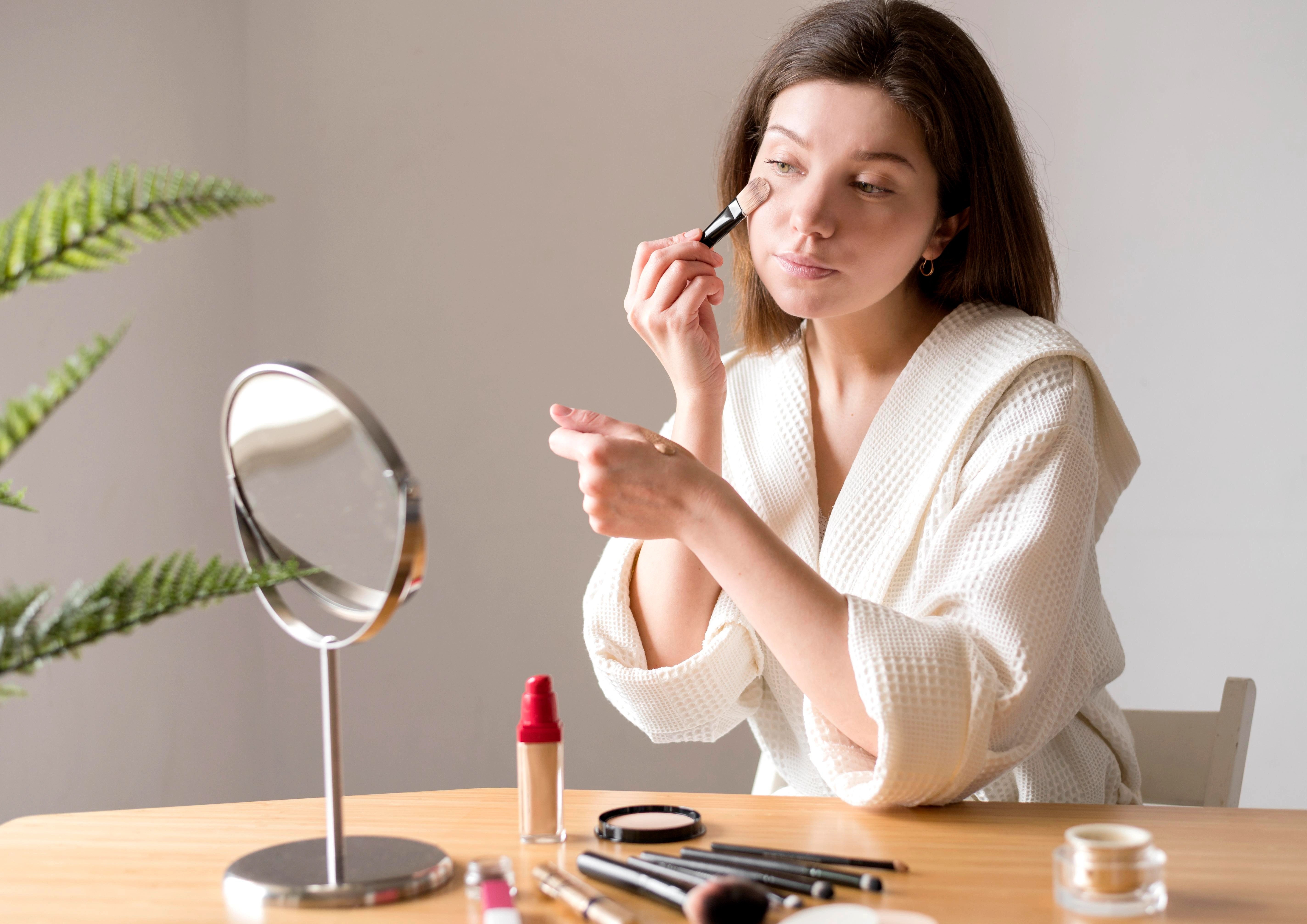 female-using-brush-foundation