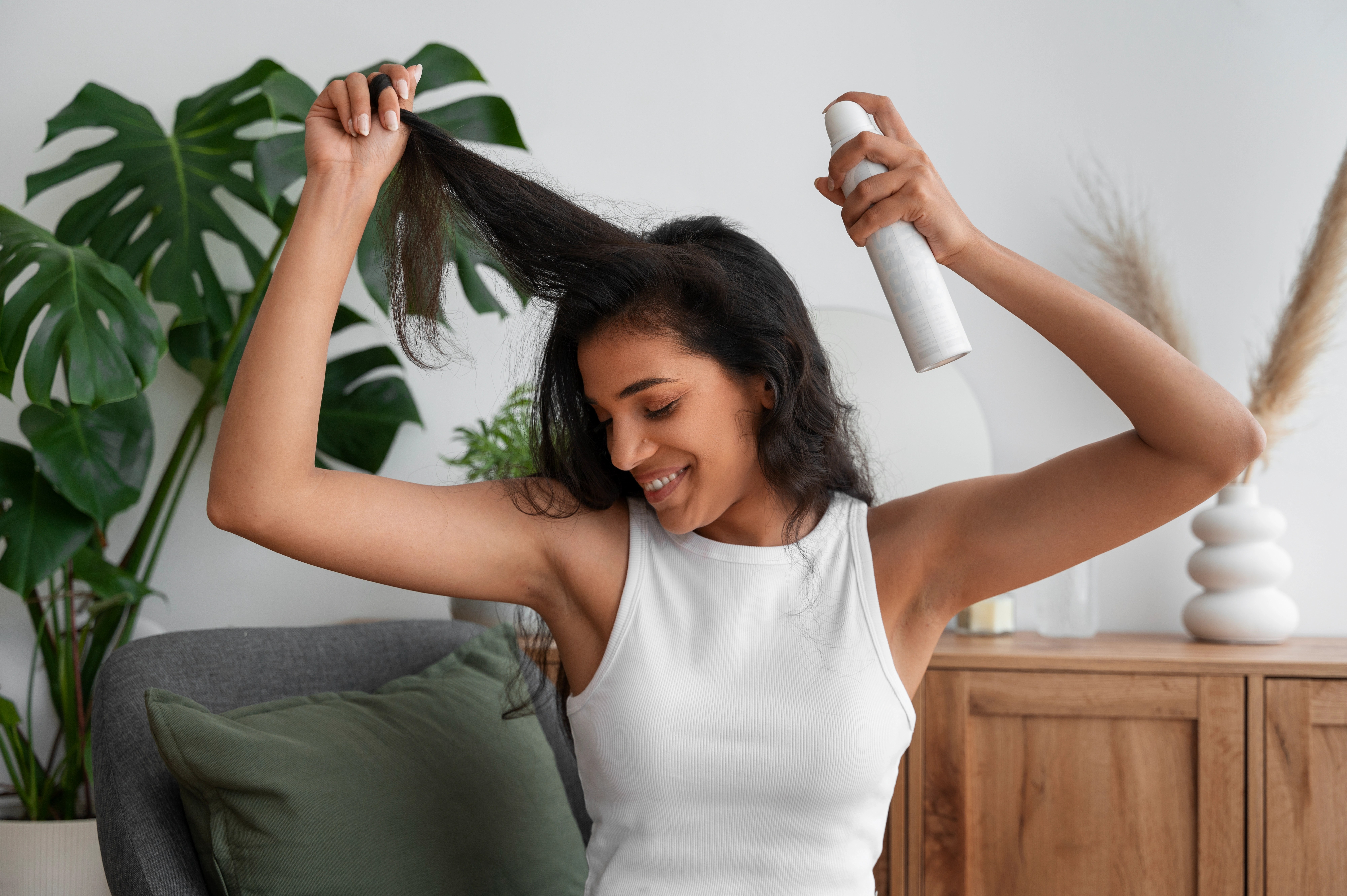 person-using-dry-shampoo