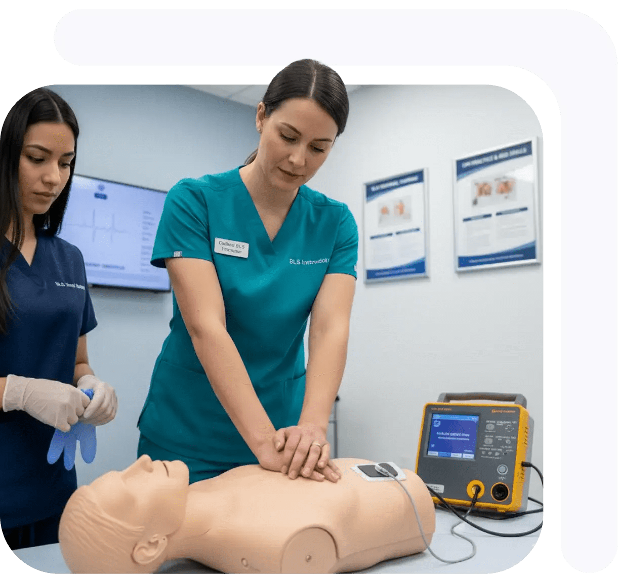 Two medical professionals practicing CPR techniques on a training mannequin in a clinical setting.
