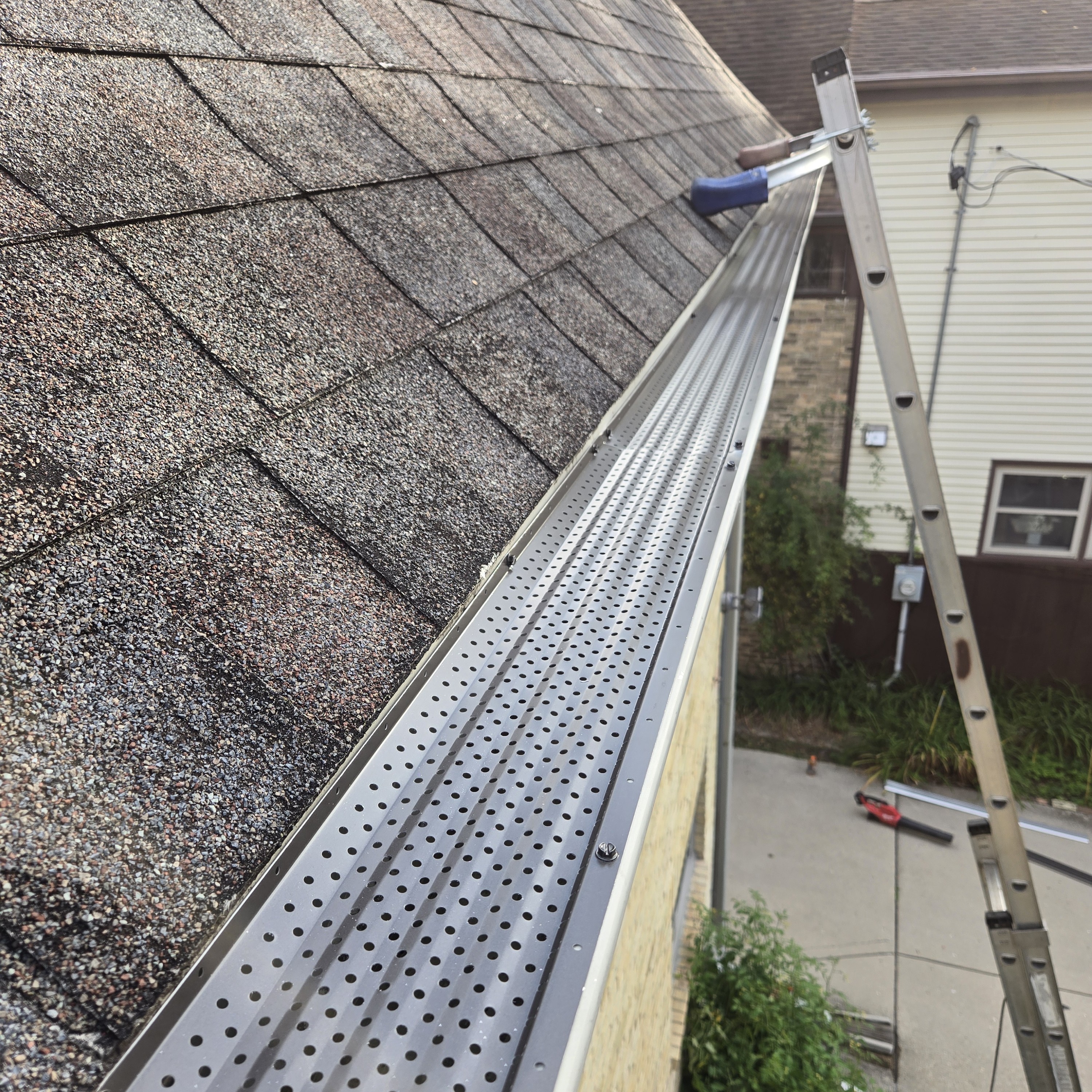 Newly installed GutterRx gutter guard system on a residential roofline to prevent debris buildup and ensure proper water flow