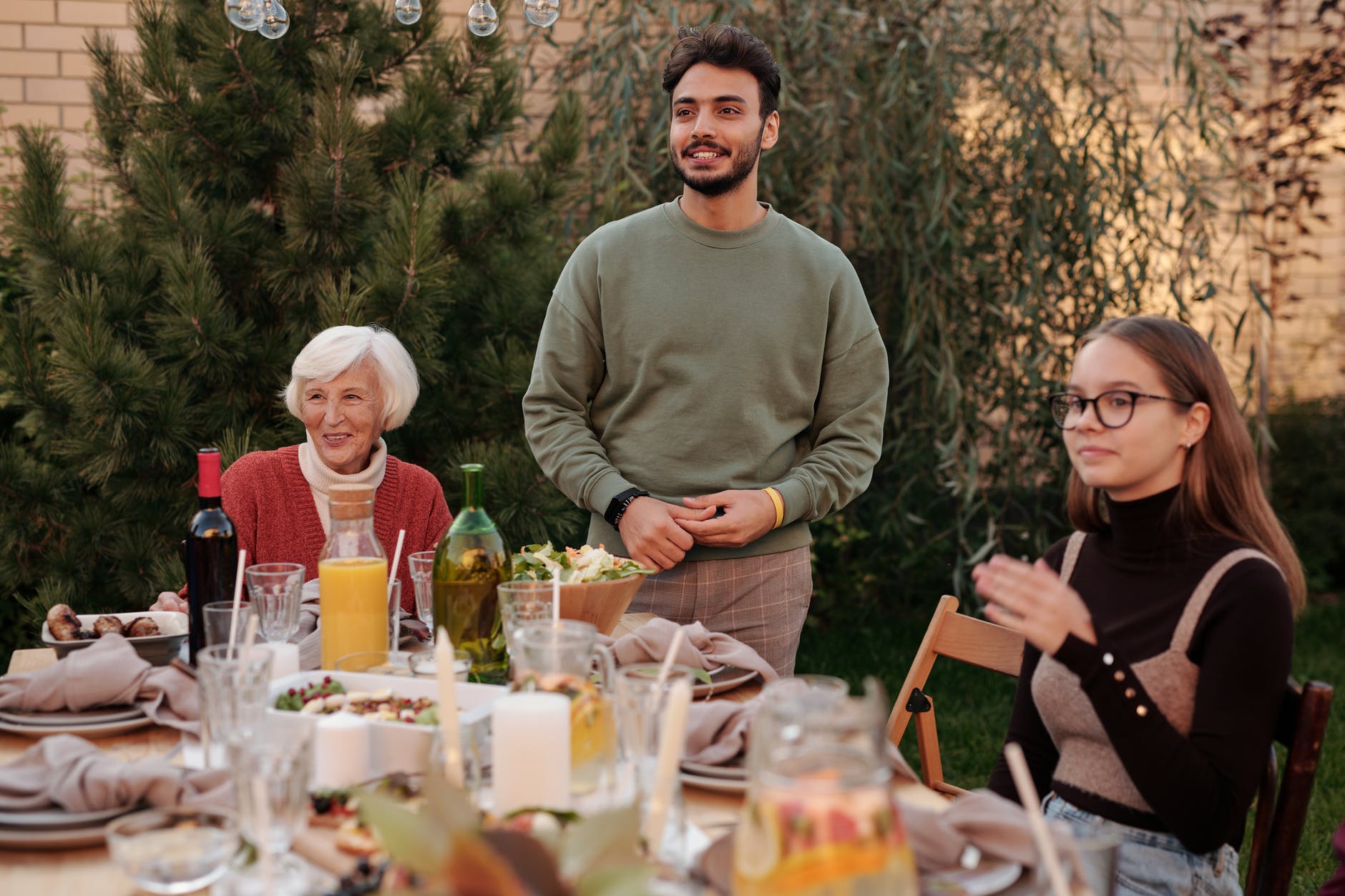 happy family sitting at table in terrace