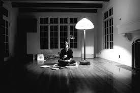Steve Jobs in his first Villa. Just a stereo, a lamb and a matress