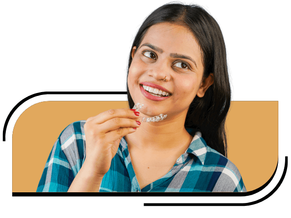 Woman holding a clear aligner