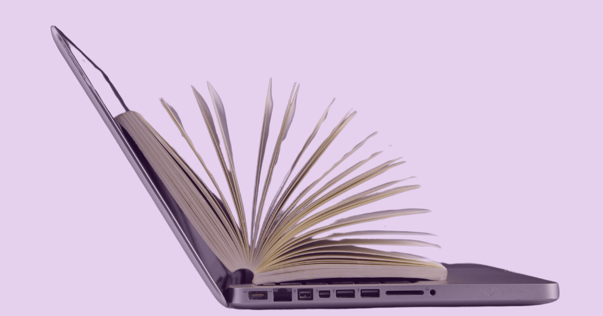 Laptop with book inside, symbolizing a software guide