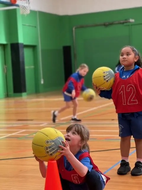 Golden Grove Students working togeher on their basketball skills