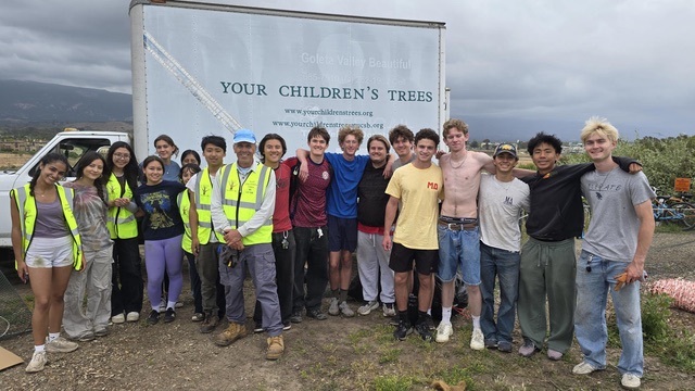 Ken Knight in a group photo with about twenty students
