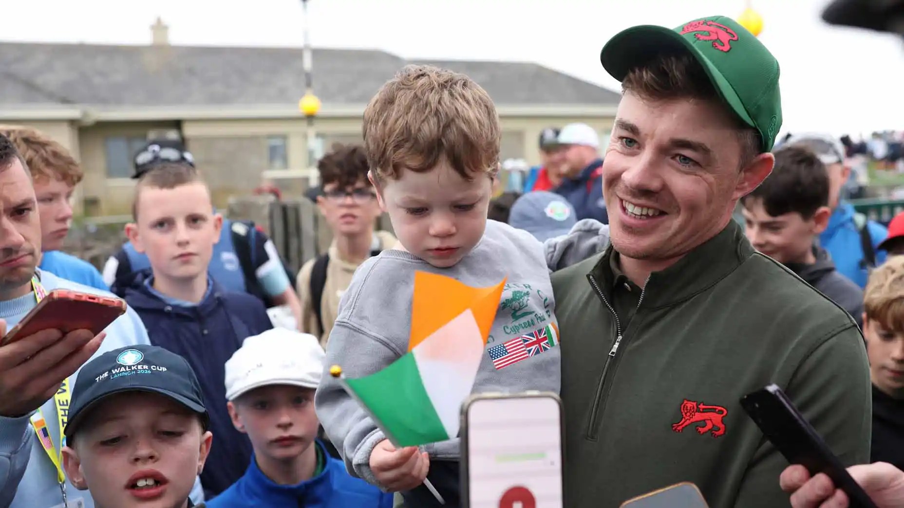 Stuart Grehan and his son, Kai, celebrate his Walker Cup win vs. Preston Stout