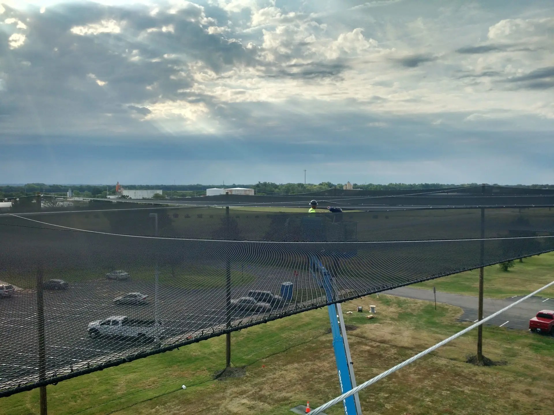 Installing Rooftop Netting to Enclosure