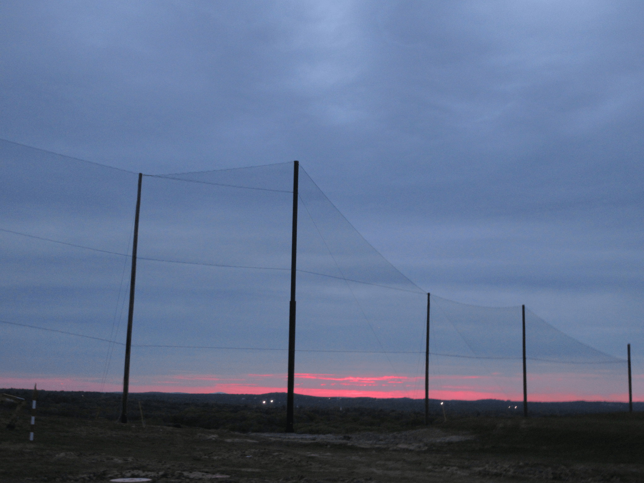 Sunset view of the completed Golf Barrier Netting Install