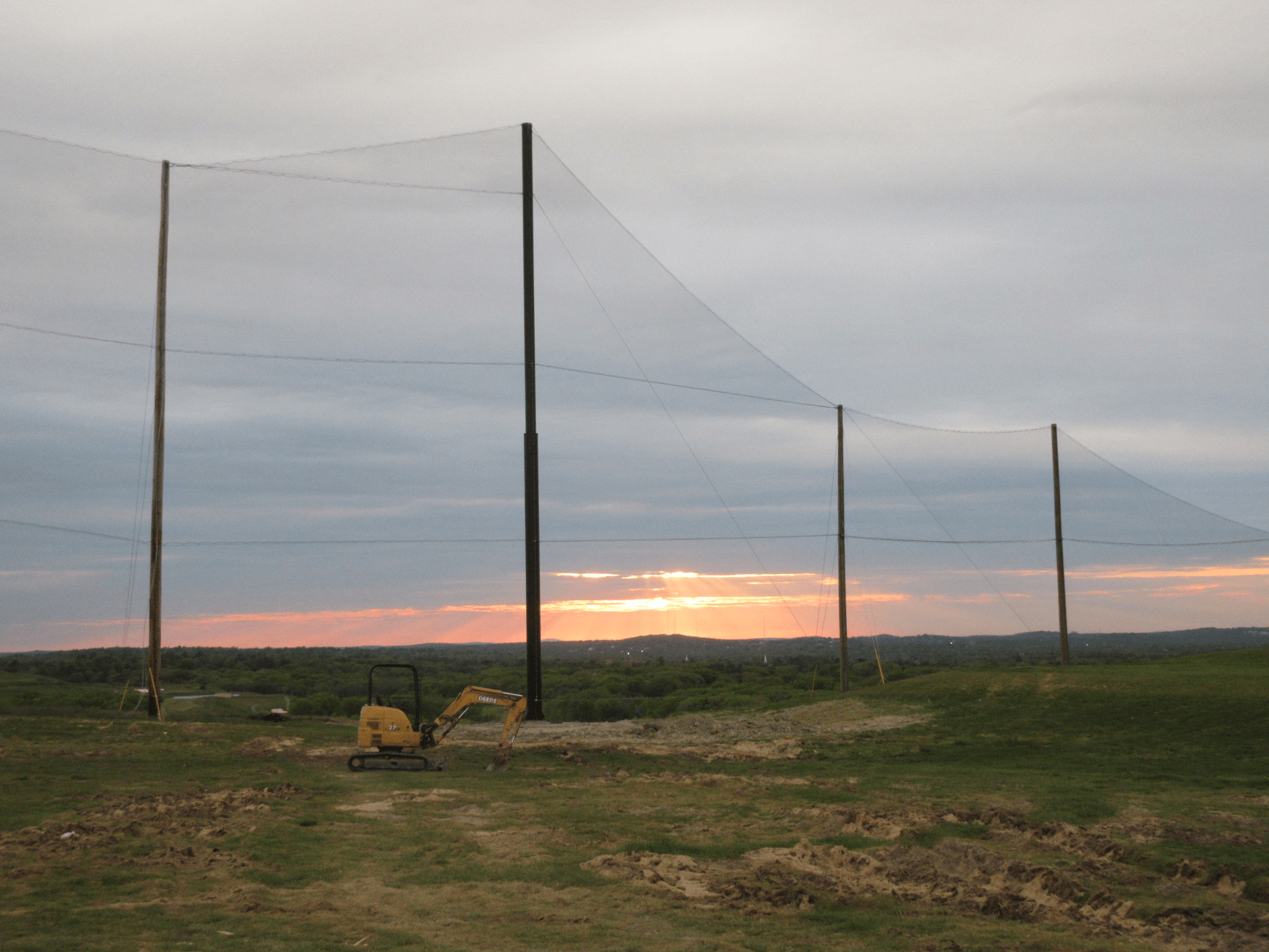 Completed view of golf netting installation