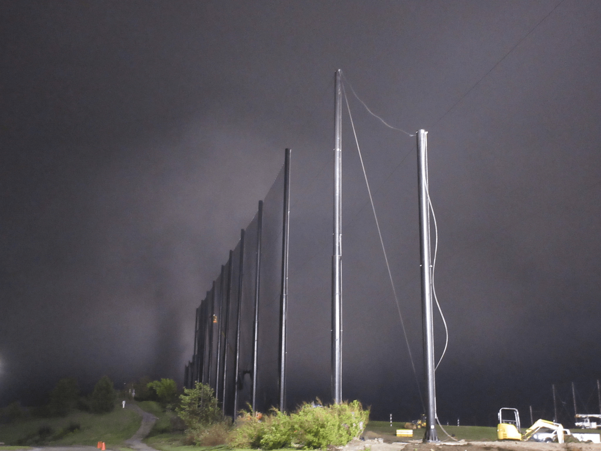 Fog rolling in at the end of the day installing Golf Netting Panels