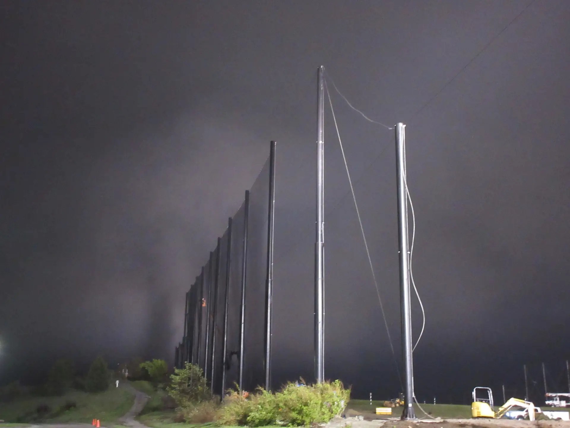 Fog rolling in at the end of the day installing Golf Netting Panels
