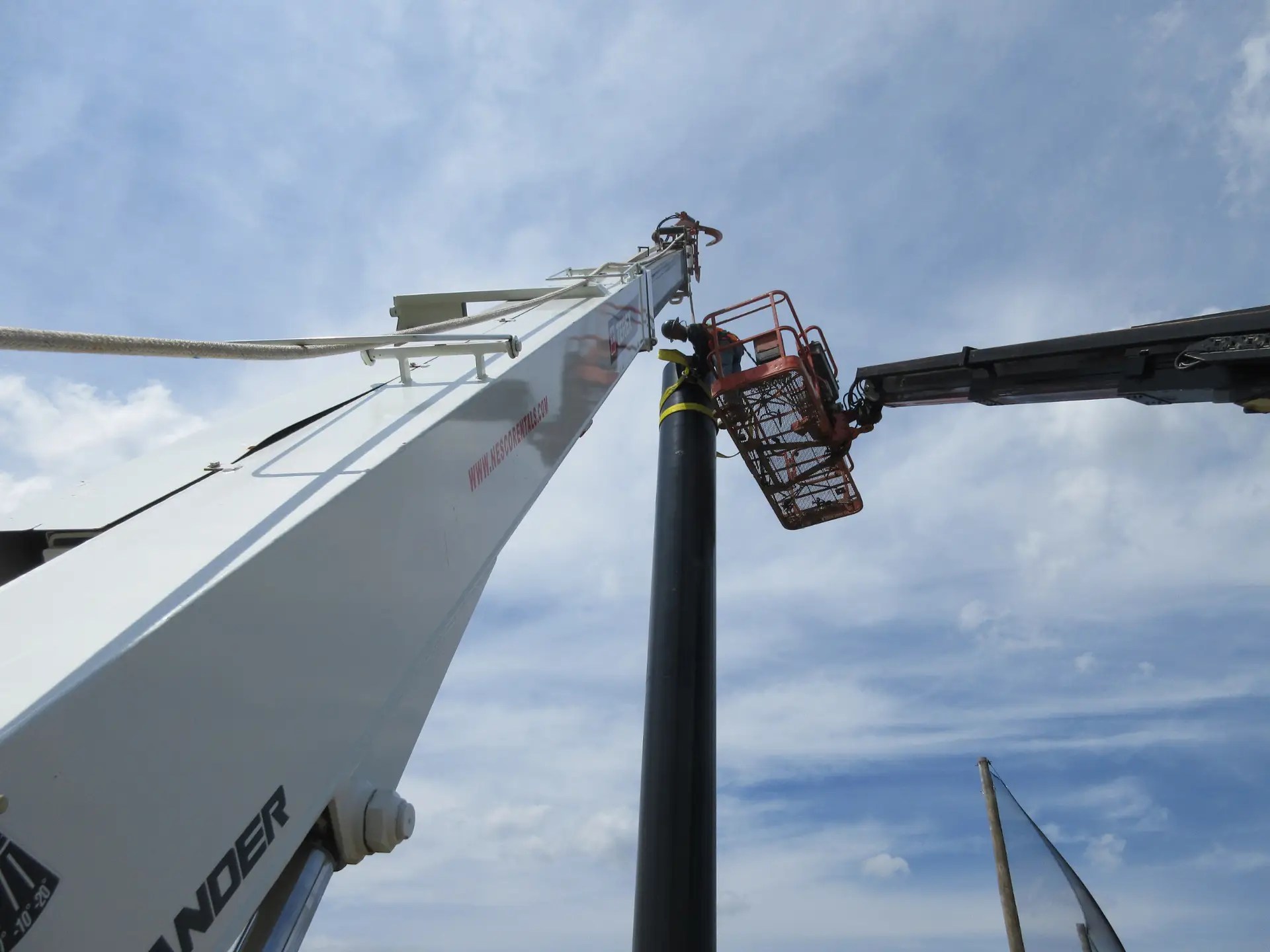 Installing Steel Poles for supporting the Golf Barrier Netting