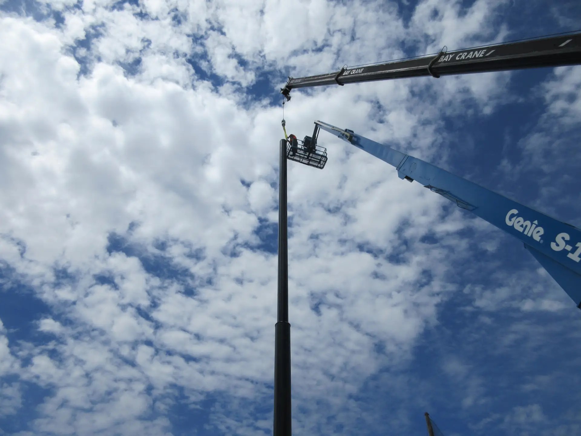 Completing the steel pole installation for the driving range