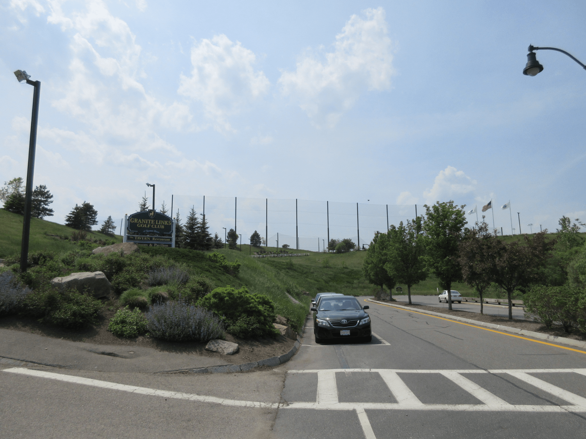 Granite Links Golf Club entrance and view of driving range netting