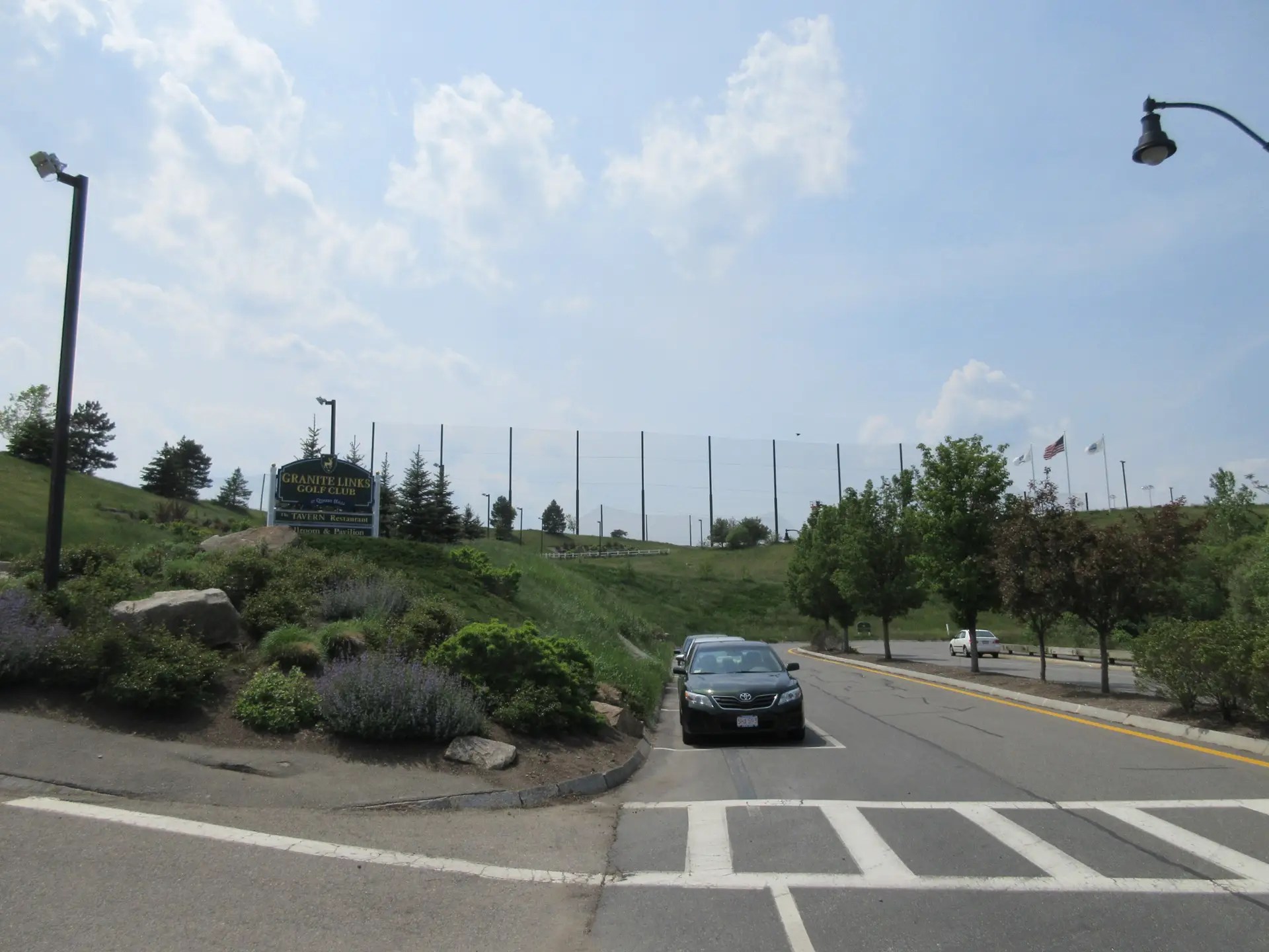 Granite Links Golf Club entrance and view of driving range netting