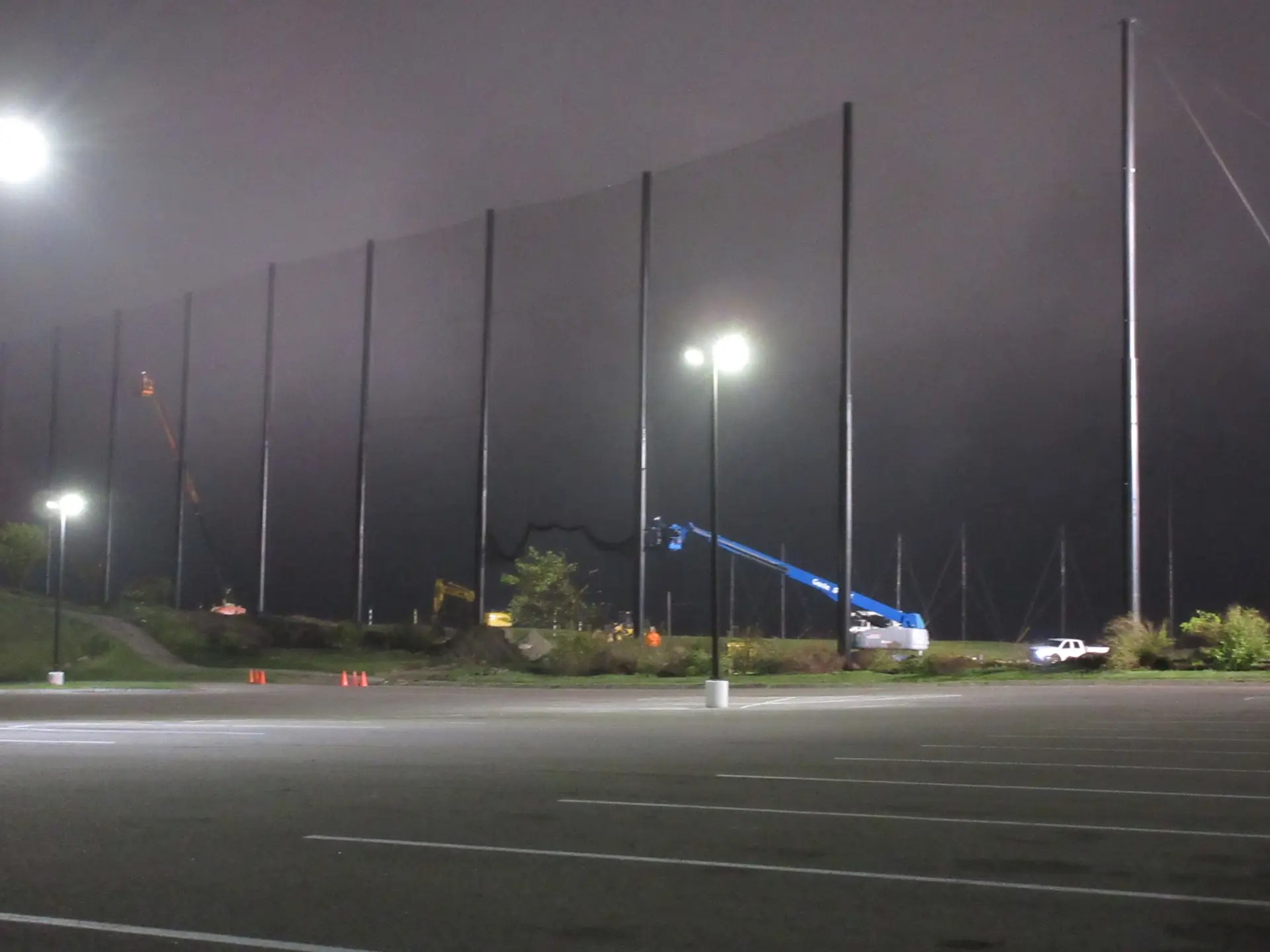 Fog rolled in at the end of the day installing golf netting panels