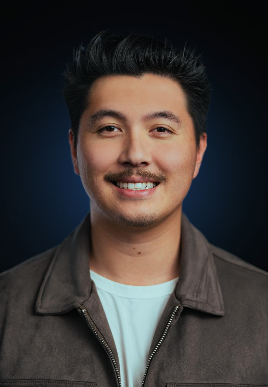 Portrait of Levi Ringo, showcasing his thoughtful expression and distinctive features against a neutral background.