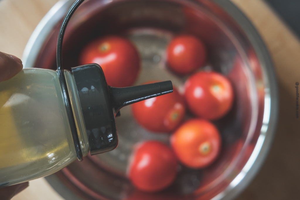 olive oil over tomatoes